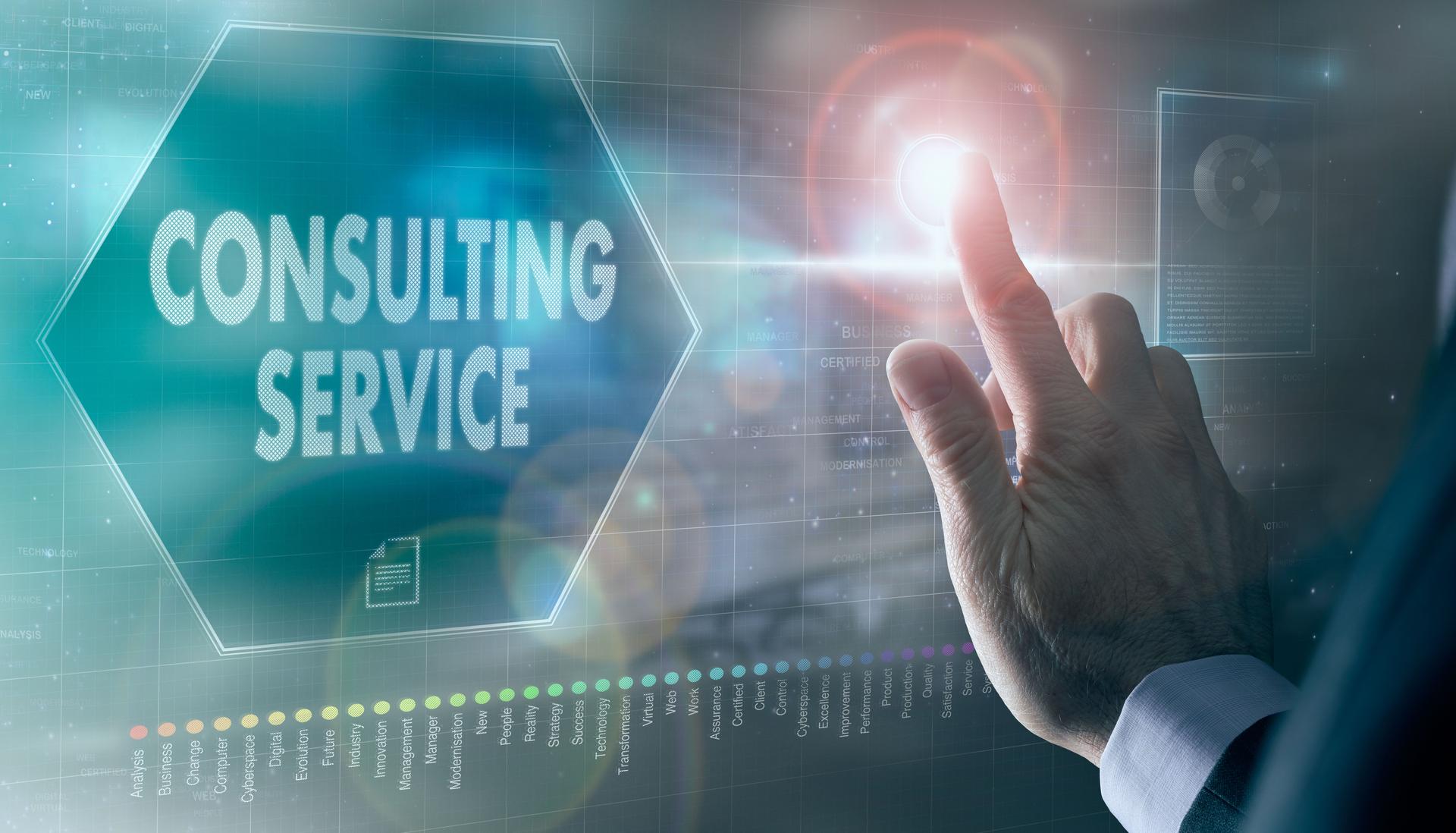 A businessman controlling a futuristic display with a Consulting Service concept on it.